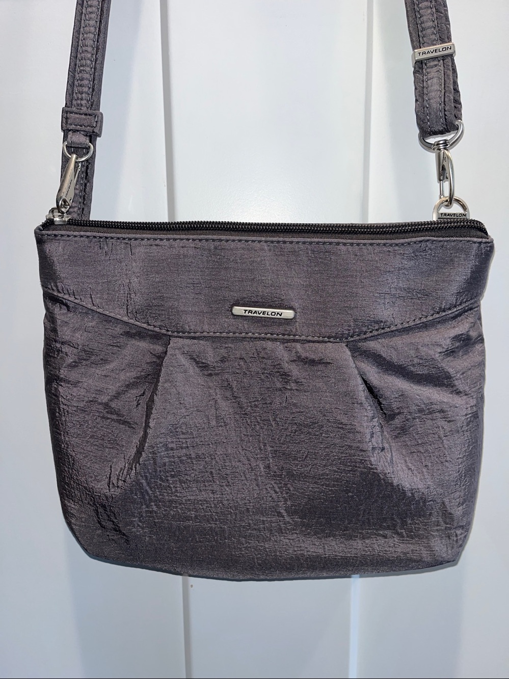 Travel on shimmery gray Crossbody travel bag.